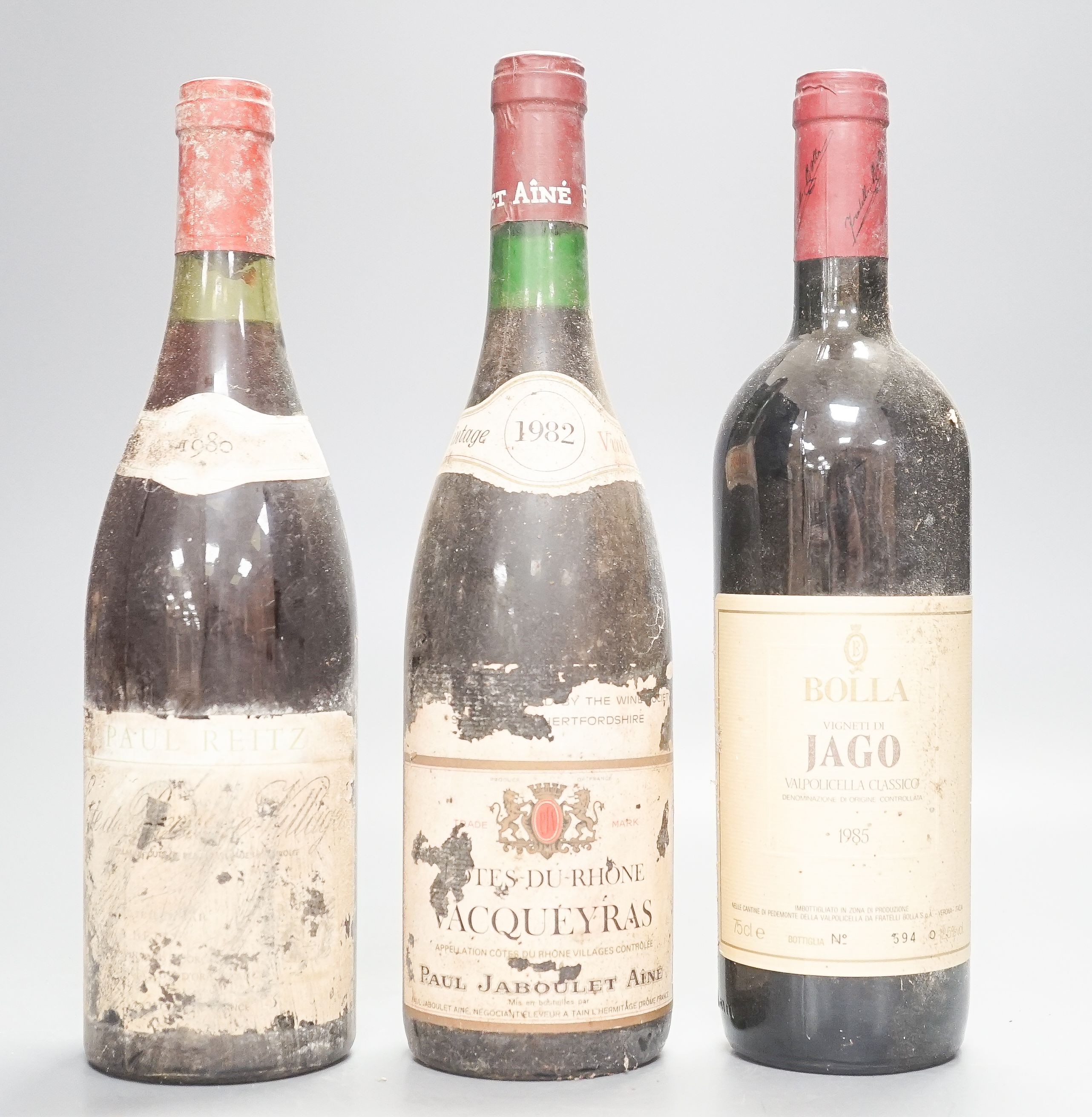 18 bottles of mixed red wines to include - two Chateau La Lagune, labels lacking so undated, one Paul Jaboulet Aine Cotes du Rhone Vacqueyras etc.